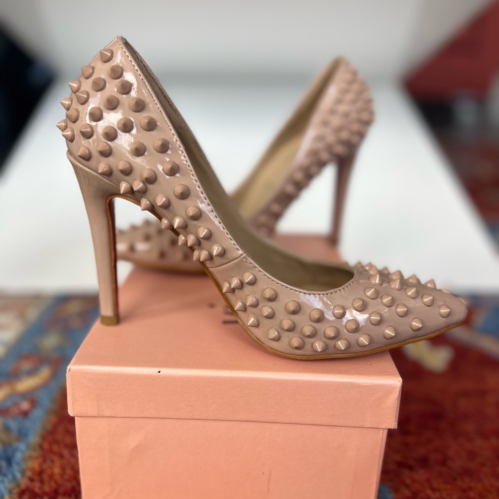 Christian Louboutin Pigalle Spikes Pointed Toe Pumps in Nude Patent Leather